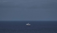 This general view shows the cruise ship MV Hondius, leaving the port of Praia, the capital of Cape Verde, on May 6, 2026. (Photo by AFP)