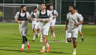 Al Shahania players attend a training session as they prepare for the play-off. 