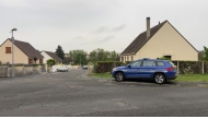 This screengrab made from an AFP video shows a gendarmerie car parked in a street in Fere-en-Tardenois, northern France. (Photo by Noorullah Shirzada / AFP)
