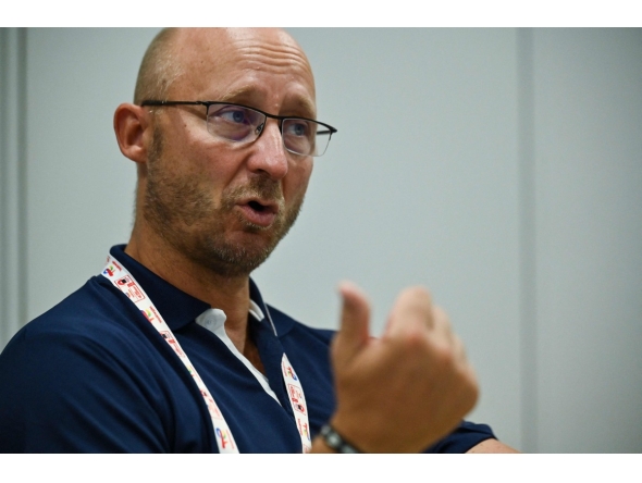 This photo taken on August 23, 2022 shows Badminton World Federation (BWF) secretary general Thomas Lund of Denmark speaking during an interview with AFP on the sidelines of the Badminton World Championships in Tokyo. Photo by Richard A. Brooks / AFP