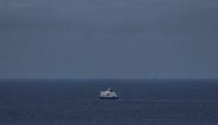 This general view shows the cruise ship MV Hondius, leaving the port of Praia, the capital of Cape Verde, on May 6, 2026. Photo by AFP