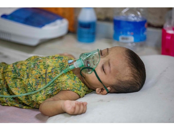 A child diagnosed with measles receives treatment inside a paediatric ward at the Bangladesh Shishu Hospital and Institute in Dhaka on May 6, 2026. (Photo by Salahuddin Ahmed / AFP)