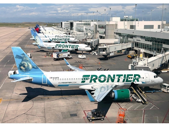 (FILES) Frontier Airlines planes are parked at gates in Denver International Airport (DEN) in Denver, Colorado, on August 5, 2023. (Photo by Daniel SLIM / AFP)
