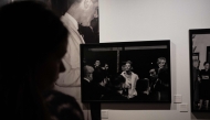A woman looks at a picture taken by Turkish photojournalist Ara Guler during the Cannes Film Festival at the Ara Guler Museum in Istanbul, on May 7, 2026. (Photo by Ozan Kose / AFP)