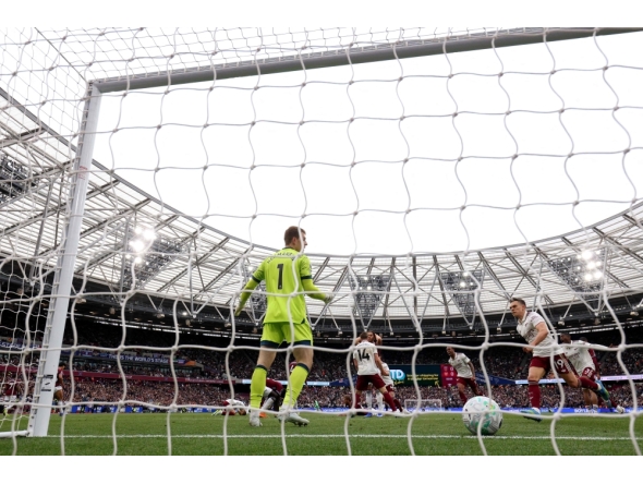 Arsenal's Norwegian midfielder  Martin Odegaard is fouled by Arsenal's Dutch defender Jurrien Timber during the English Premier League football match between West Ham United and Arsenal at the London Stadium, in east London on May 10, 2026. (Photo by Adrian Dennis / AFP)