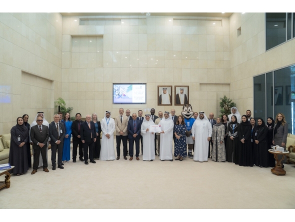 President of UDST Dr. Salem Al-Naemi with other officials receiving the certification. 