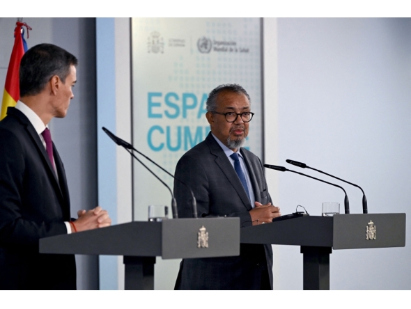 Spain's Prime Minister Pedro Sanchez (L) and World Health Organization (WHO) Director-General Tedros Adhanom Ghebreyesus give a joint press conference at the Moncloa Palace in Madrid on May 12, 2026. WHO chief said 'work not over' after hantavirus evacuation, AFP reports. (Photo by Javier Soriano/ AFP)