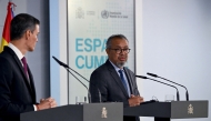Spain's Prime Minister Pedro Sanchez (L) and World Health Organization (WHO) Director-General Tedros Adhanom Ghebreyesus give a joint press conference at the Moncloa Palace in Madrid on May 12, 2026. WHO chief said 'work not over' after hantavirus evacuation, AFP reports. (Photo by Javier Soriano/ AFP)