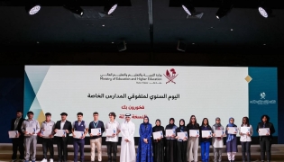 Officials with students during the ceremony. 