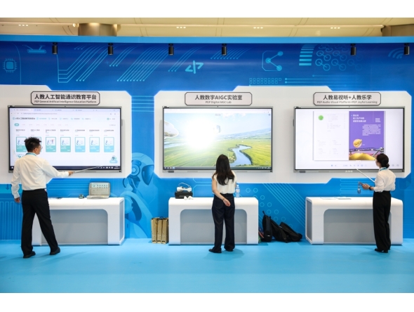 Exhibitors demonstrate products at an exhibition on achievements of global digital education held during the 2026 World Digital Education Conference in Hangzhou, east China's Zhejiang Province. (Xinhua/Jiang Han)
 