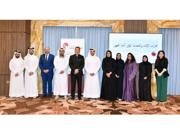Officials pose for a group photo with the participants of public speaking training programme.