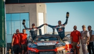 Qatar's Nasser Saleh Al-Attiyah and his Spanish navigator Candido Carrera celebrate with the support crew after winning the 2026 Jordan Rally.