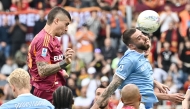 Roma's Italian defender #23 Gianluca Mancini heads the ball and scores his team's second goal during the Italian Serie A football match between Roma and Lazio at Olympic stadium in Rome on May 17, 2026. (Photo by Isabella BONOTTO / AFP)