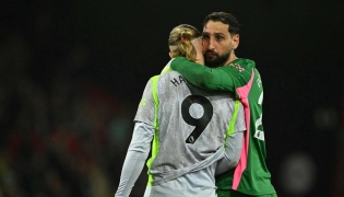 Manchester City's Italian goalkeeper #25 Gianluigi Donnarumma hugs Manchester City's Norwegian striker #09 Erling Haaland after the English Premier League football match between Bournemouth and Manchester City at the Vitality Stadium in Bournemouth, southern England on May 19, 2026. (Photo by Glyn KIRK / AFP)

