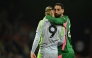 Manchester City's Italian goalkeeper #25 Gianluigi Donnarumma hugs Manchester City's Norwegian striker #09 Erling Haaland after the English Premier League football match between Bournemouth and Manchester City at the Vitality Stadium in Bournemouth, southern England on May 19, 2026. (Photo by Glyn KIRK / AFP)

