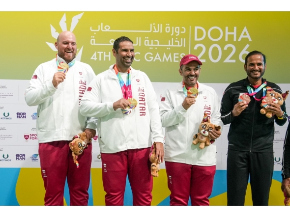 Qatar's Angelo Scalzoni, Mohammed Al Rumaihi and Saeed Abu Shareb celebrate with their gold medals.