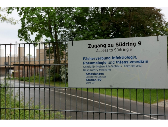 (FILES) A sign indicates the site of a department for infectious diseases and respiratory medicine at the Campus Virchow of the Charite hospital in Berlin on May 11, 2026. (Photo by Odd ANDERSEN / AFP)