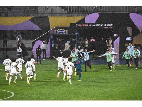 North Korea's Naegohyang Women's FC players celebrate after beating South Korea's Suwon FC Women in Suwon on May 20, 2026. (Photo by Pedro Pardo / AFP)
 