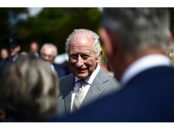 Britain's King Charles III attends a garden party at Hillsborough Castle in Hillsborough, Northern Ireland on May 20, 2026, on the second day of a three-day royal visit to Northern Ireland. (Photo by Henry NICHOLLS / POOL / AFP)
