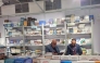 Abdulmonem Kamil (left) at his booth.