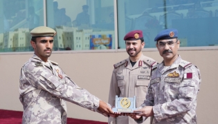 Chief of Staff of the Qatari Armed Forces H E Lieutenant General (Pilot) Jassim bin Mohammed Al Mannai and  Amiri Guard Commander H E Major General Staff Mohammed bin Sultan Al Suwaidi with a graduate during the ceremony. 
