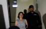 Frenchwoman Marine Rousseau (L) leaves the Setubal courthouse, suspected of abandoning two children, in Setubal, Portugal, on May 23, 2026. (Photo by Filipe Amorim / AFP)