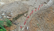 An aerial drone photo taken on May 24, 2026 shows rescuers working on site after a heavy rainstorm hit Yongchuan District in southwest China's Chongqing Municipality. (Xinhua/Wang Quanchao)
