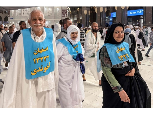 Iranian pilgrims (front) pose for a photograph after performing the Umrah minor pilgrimage at the Grand Mosque complex in the holy city of Mecca on May 23, 2026, ahead of the annual Hajj pilgrimage. (Photo by AFP)