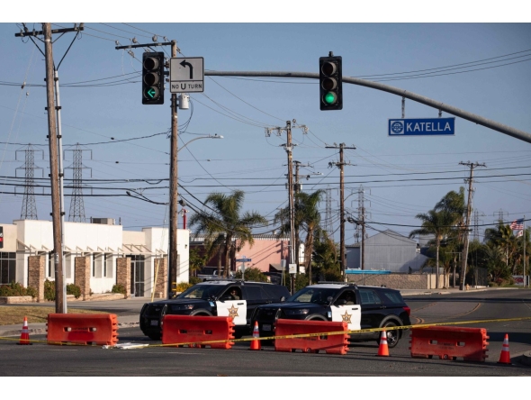 Orange County sheriff deputies block Western Avenue at Katella Avenue as roads remain closed after a chemical leak from a large storage tank prompted evacuations in Garden Grove, California, on May 24, 2026. Photo by Blake Fagan / AFP