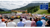 Protesters listen to speakers at the A13 Brenner Highway in the direction of Italy during a demonstration and the blockade of the Brenner Base Tunnel against transit traffic near the A13 Brenner Highway in the direction of Italy, on May 30, 2026, on the Tyrolean Brenner Highway. (Photo by Joe Klamar / AFP)