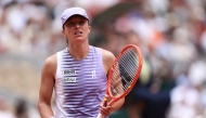 Poland's Iga Swiatek reacts as she plays against Ukraine's Marta Kostyuk during their women's singles match on day 8 of the French Open tennis tournament on Court Philippe-Chatrier at the Roland-Garros Complex in Paris on May 31, 2026. (Photo by Anne-Christine Poujoulat / AFP)