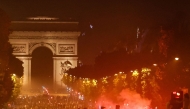 PSG supporters gather on the Champs-Elysees Avenue after the club won the UEFA Champions League final between Paris Saint-Germain (PSG) and Arsenal FC played in Budapest, in Paris on May 30, 2026. (Photo by ROMEO BOETZLE / AFP)