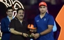 Rajasthan Royals' Indian cricket player Vaibhav Sooryavanshi (R) is awarded the 