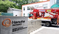 A vehicle of Korea Electric Power Corporation enters the main gate at the Hanwha Aerospace plant in Daejeon on June 1, 2026, after a reported explosion. (Photo by Yonhap / AFP) 