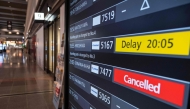 A departures board shows a cancelled flight to Okinawa after Severe Tropical Storm Jangmi shut down the airport at Haneda Airport in Tokyo on June 1, 2026. (Photo by Andrew Caballero-Reynolds / AFP)
