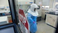 A researcher works inside the Viral Hemorrhagic Fever Laboratory at the Uganda Virus Research Institute in Entebbe, Uganda. (Xinhua/Nie Zuguo)