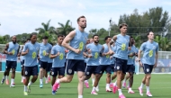 England's Jordan Henderson warms up with teammates during a training session in Palm Beach Gardens, Florida, yesterday.