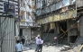 Forensics team members take photographs of the site following a fire that broke out at a hotel in New Delhi on June 3, 2026. (Photo by Arun Sankar / AFP)