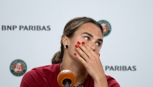 Aryna Sabalenka reacts during a press conference after being defeated by Diana Shnaider during their women's quarter final singles match on day 11 of the French Open tennis tournament on Court Philippe-Chatrier at the Roland-Garros Complex in Paris on June 3, 2026. (Photo by Sébastien DUPUY / AFP)
