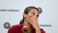 Aryna Sabalenka reacts during a press conference after being defeated by Diana Shnaider during their women's quarter final singles match on day 11 of the French Open tennis tournament on Court Philippe-Chatrier at the Roland-Garros Complex in Paris on June 3, 2026. (Photo by Sébastien DUPUY / AFP)
