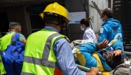 Medics and rescuers carry Mountaineer Dawa Sherpa upon his arrival at the HAMS Hospital in Kathmandu on June 4, 2026. (Photo by Prabin Ranabhat / AFP)