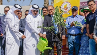 Ambassador of India to Qatar H E Vipul with Assistant Director of the Public Parks Department Mohammed Abdullah Mohammed and other officials planting a sapling during the event.