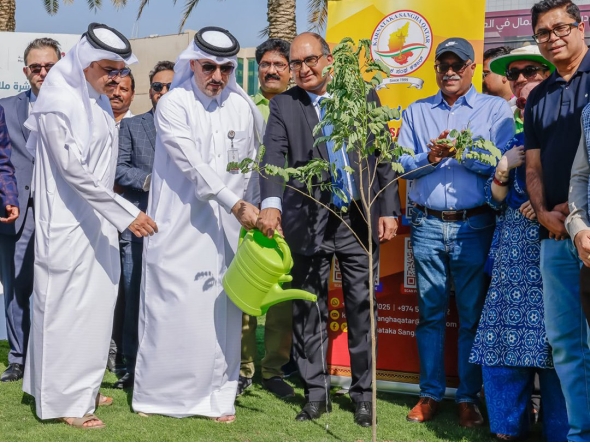 Ambassador of India to Qatar H E Vipul with Assistant Director of the Public Parks Department Mohammed Abdullah Mohammed and other officials planting a sapling during the event.