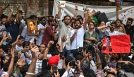 Cockroach Janta Party (CJP) founder Abhijeet Dipke (C, right) shouts slogans during a protest over alleged irregularities in the country's major examinations, in New Delhi on June 6, 2026. (Photo by Arun Sankar / AFP)
 