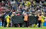 Denmark's and Ukraine's players huddle to accompany Christian Eriksen to a waiting ambulance during the football international friendly match between Denmark and Ukraine at Odense Stadium in Denmark, on June 7, 2026. (Photo by Bo Amstrup / Ritzau Scanpix / AFP)