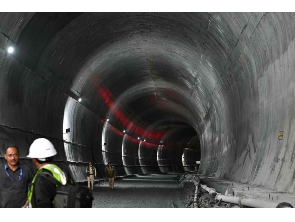 Indian police personnel stand guard at the Zojila tunnel, India's longest road tunnel project connecting Jammu and Kashmir state with the Ladakh region on June 9, 2026. (Photo by Tauseef Mustafa/ AFP)