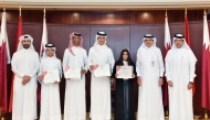 QIIB’s Chief Executive Officer Dr. Abdulbasit Ahmed Al-Shaibei poses with the riders during the ceremony. 