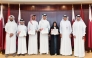 QIIB’s Chief Executive Officer Dr. Abdulbasit Ahmed Al-Shaibei poses with the riders during the ceremony. 