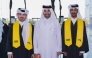 Graduating students and an official during the ceremony.