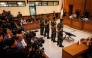 Four Indonesian military personnel accused of throwing acid at a human rights activist attend a verdict hearing at a military court in Jakarta on June 10, 2026. (Photo by Yasuyoshi Chiba / AFP)